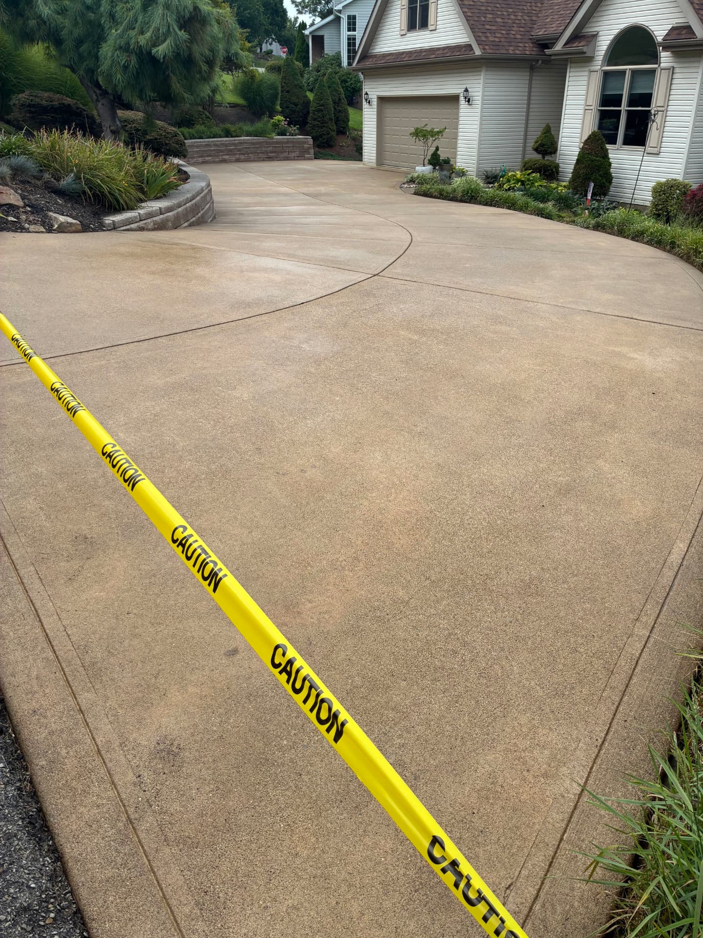 Residential concrete driveway after professional surface cleaning